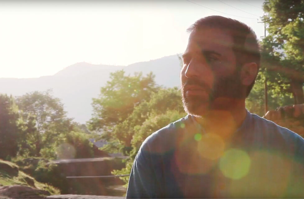 Yousuf Bhat Martyred in Kashmir Valley, India Man stands outside