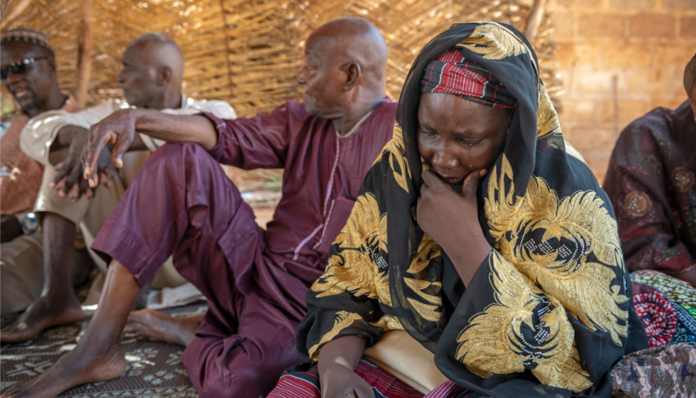 group of individuals in African country talking and thinking